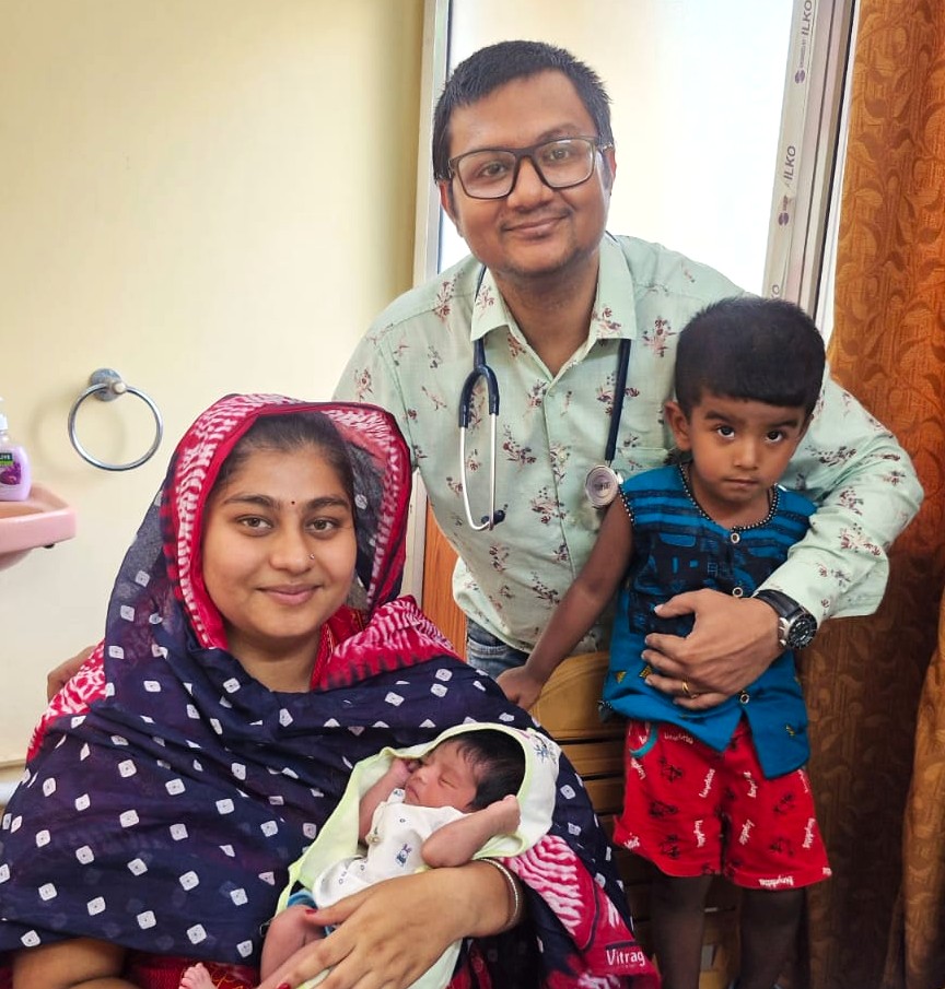Dr. Surajit Hazra with parents and newborn baby